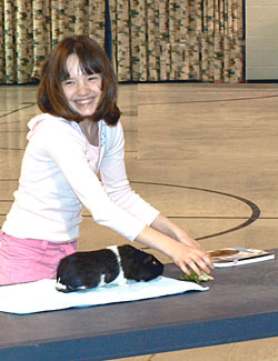 A 4-H'er with a Guinea pig.